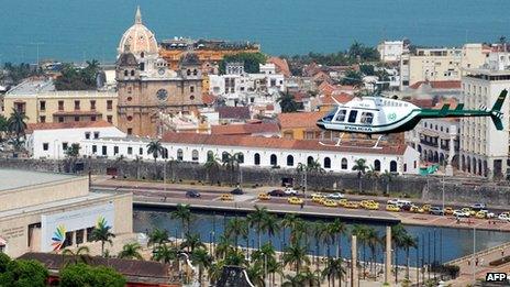 Police helicopter flies over centre of summit venue Cartagena on 10 April 212