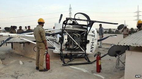 The helicopter surrounded by police and emergency personnel, Bangalore - 12 April 2012