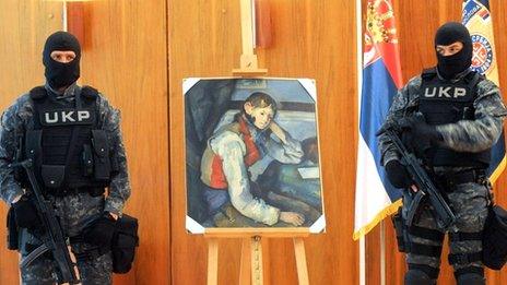 Serbian policemen guard Cezanne's The Boy in the Red Vest