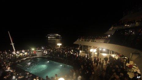 Passengers participating in a memorial service on MS Balmoral