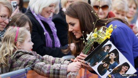 Duchess of Cambridge speaks with a girl in the crowd during a visit to The Treehouse in Ipswich on March 19, 2012