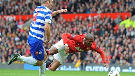 Manchester United's Ashley Young wins a penalty against QPR