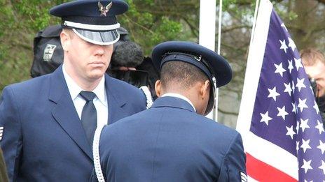 A flag is raised at a memorial to USAF personnel at Henham Park