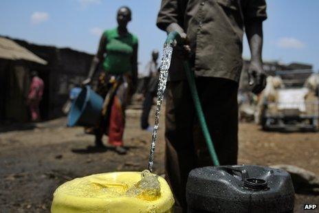 Man filling jerry can