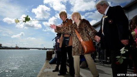 Flowers being thrown into water at Southampton Titanic service