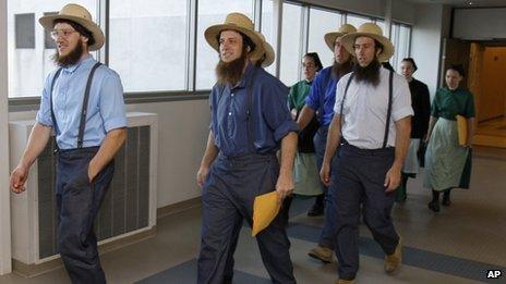 Members of the Amish community leave a courthouse in Cleveland, Ohio 19 April 2012