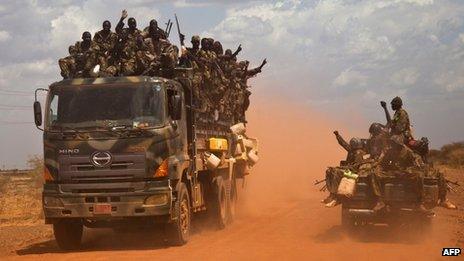 SPLA (South Sudan People's Liberation Army) vehicles drive on the road from Bentiu to Heglig, on April 17, 2012