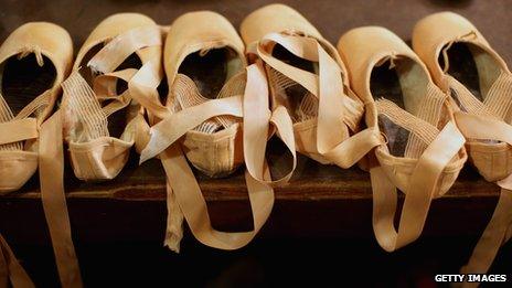 Ballet shoes lined up in a row