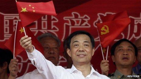 Bo Xilai waves a Chinese national flag. File photo