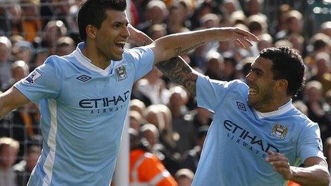 Sergio Aguero and Carlos Tevez celebrate Man City's first-half goal