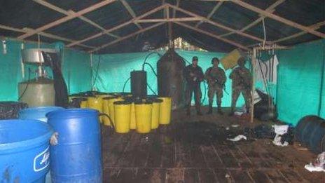 Vats of chemicals inside a cocaine laboratory