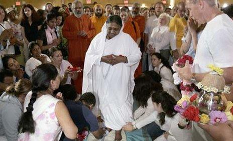 Sri Mata Amritanandamayi Dev, the hugging saint known as "Amma" (mother) In the middle of devotees on the first day of her Australia retreat on April 12, 2012 in Melbourne, Australia