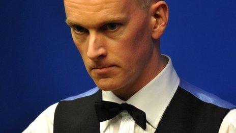 Peter Ebdon ponders a shot during his defeat by Ronnie O'Sullivan