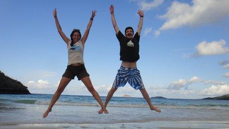 Katie and George jumping for joy in the Galapagos