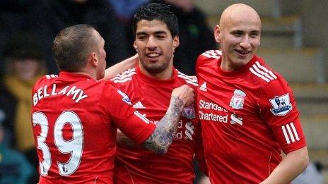 Luis Suarez (centre) celebrates scoring for Liverpool