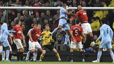 Vincent Kompany rises to head in