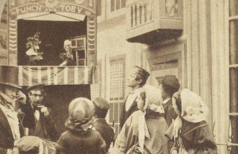 Photograph portraying a Punch and Toby puppet show dated 1860s. George Speaight Punch & Judy Collection. (Photo from V&A Museum of Childhood)