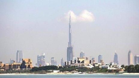 The Dubai skyline. The Burj Khalifa stands prominently in the centre, reaching into the sky.