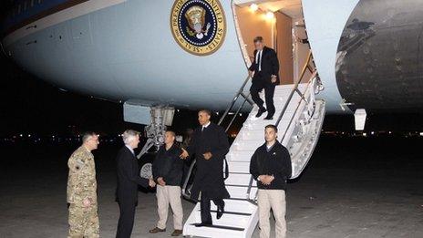 President Barack Obama is greeted by Lt. Gen Curtis "Mike" Scaparrotti, left, and US Ambassador to Afghanistan Ryan Crocker, second left, as he steps off Air Force One at Bagram Air Field in Afghanistan