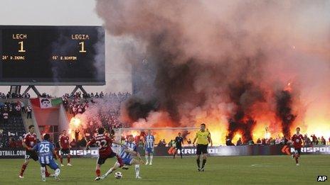 Hooligans light fires during the Polish football cup final between Legia Warszawa and Lech Poznan in Bydgoszcz, Poland, 3 May 2011