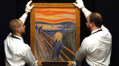 Two art handlers hold Munch's Scream artwork