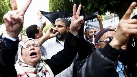 Salafists protest against Nabil Karoui, the owner of Nessma, outside a court in Tunis on 19 April 2012