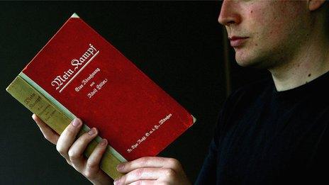 Man reading Mein Kampf