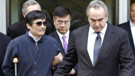 Chinese dissident Chen Guangcheng (L) is led out of the US embassy in Beijing by Assistant Secretary of State Kurt Campbell (R) and US Ambassador Gary Locke (C) in Beijing, China, 2 May 2012