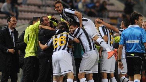 Juventus celebrate scoring against Cagliari - their win sealed the Serie A title