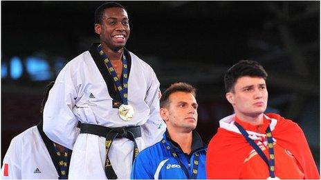 GB's Lutalo Muhammad stands atop the podium after winning gold