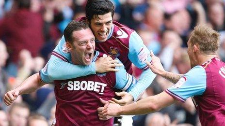 Kevin Nolan (left) celebrates scoring the opening goal with team-mate James Tomkins and Jack Collison (right)