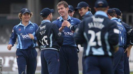 Graeme McCarter celebrates taking his first wicket against Middlesex