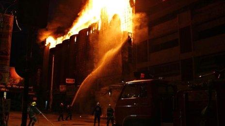 Firefighters battle the blaze in Butuan on 9 May 2012