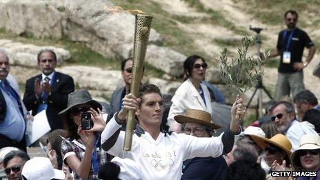 World champion swimmer Spyros Gianniotis with the torch