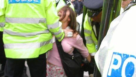 Police officer arresting Lorraine