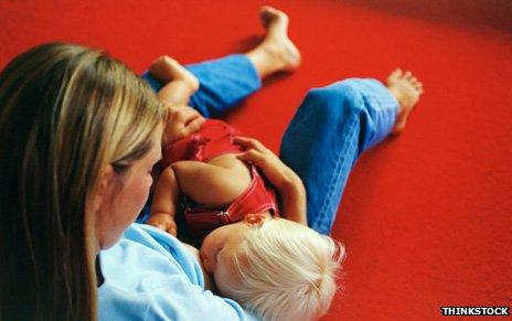 Mother breastfeeding her son