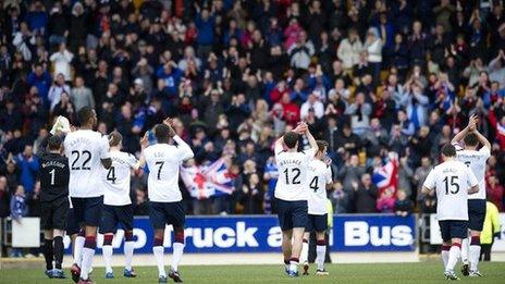 Rangers players wave to their fans