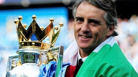 Manchester City boss Roberto Mancini with the Premier League trophy