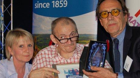 Mick Mills is given his fundraiser of the year award by Robert Lindsay