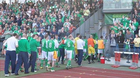 Guernsey FC walking off the pitch at Footes Lane being cheered by the crowd