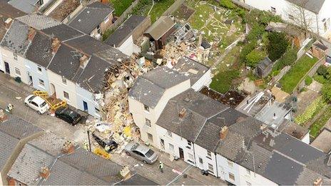 Damaged house shown from the air