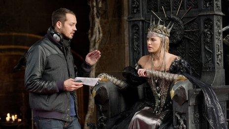 Director Rupert Sanders with Charlize Theron as the wicked Queen Ravenna