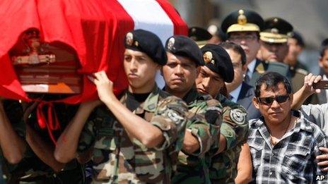 Dionisio Vilca walks behind his son's coffin at the police airport in Callao 3 May 2012