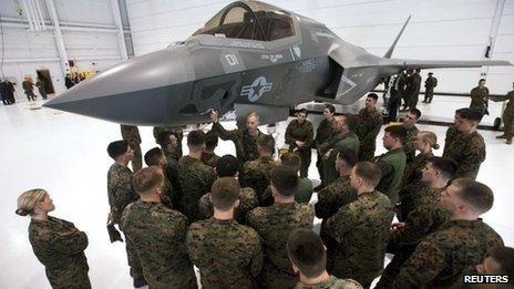 A group of US soldiers are shown an F-35 fighter jet at Eglin Air Force Base, Florida 24 February 2012