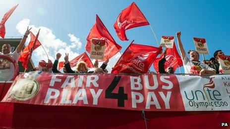 Bus drivers on open-top protest bus