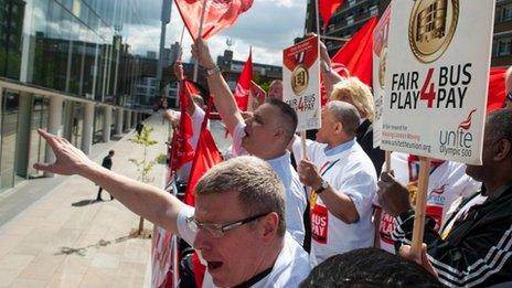 Bus drivers on open-top protest bus