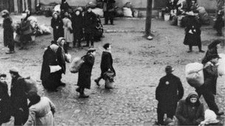 Jews are gathered at an assembly point in the Kaunas ghetto for deportation.