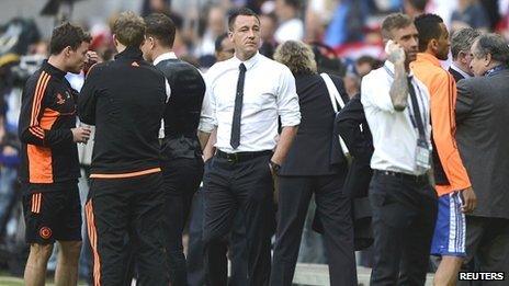 Chelsea's captain John Terry (centre) stands by the pitch before the start of the Champions League final