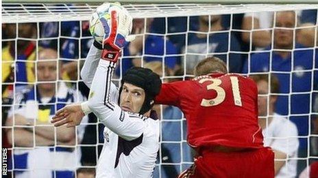 Chelsea's goalkeeper Petr Cech saves in front of Bayern Munich's Bastian Schweinsteiger