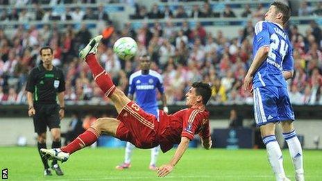 Bayern Munich's Mario Gomez attempts an acrobatic effort